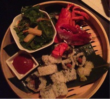 Ninja New York offers an unforgettable dining experience. This meal included sushi, japanese salad, and lobster.