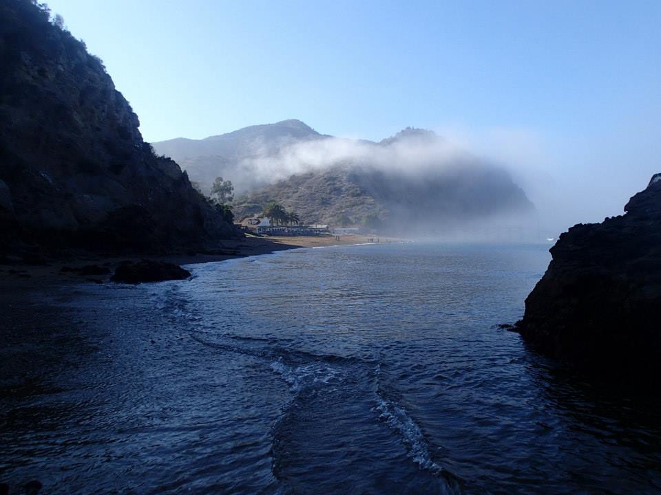 A photo of clouds wrapping around Catalina Island. Students had the chance to explore the shore and bay, as well as the inland mountains.