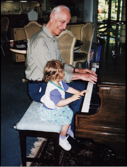 Junior Alexa Geidel sits with her grandfather at the piano.  The loss of her hero inspired a reflection of what mourning means along with the crucial role tradition plays in a family.