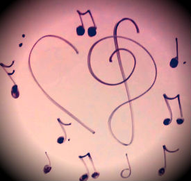 A bass and treble clef formed into a heart. Music is expressed in many forms. 