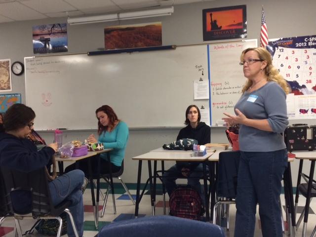 Gail Engstrom from the Phoenix Rescue Mission speaks to students about the impact of their project. Engstrom came to the Fiber Arts meeting on Nov. 26.