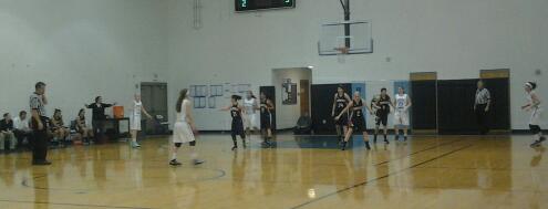 Horizon Honors HS Girls Varsity Basketball team, playing on offense. The girls are using strategies to get around the other team and make a shot. 