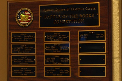 This is the Battle of the Books plaque, found in the media center. The names of the winners are posted on it from  the first time the Battle of the Books was held. 