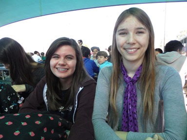 Eighth graders Skylar Kemper and Emily Bukoski smile for a photo. Both girls tried out for spring sports, and are excited for a new season.