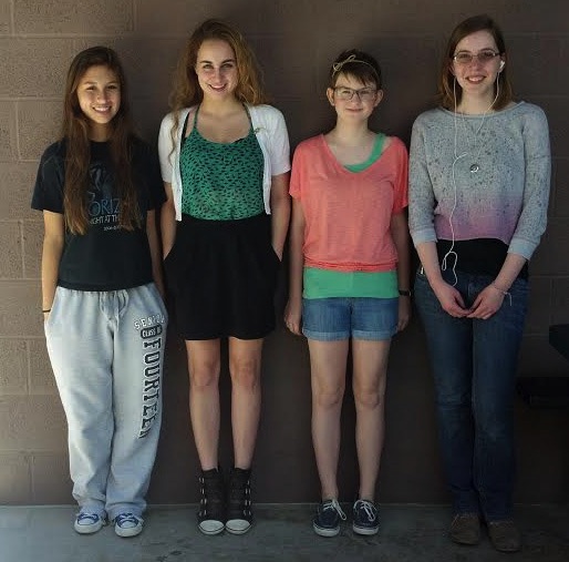 Four cute Horizonites pose against the wall; (left to right) senior Lauren Arenas, junior Alexa Geidel, seventh grader Addison Bennett, and senior Katy Abbe.