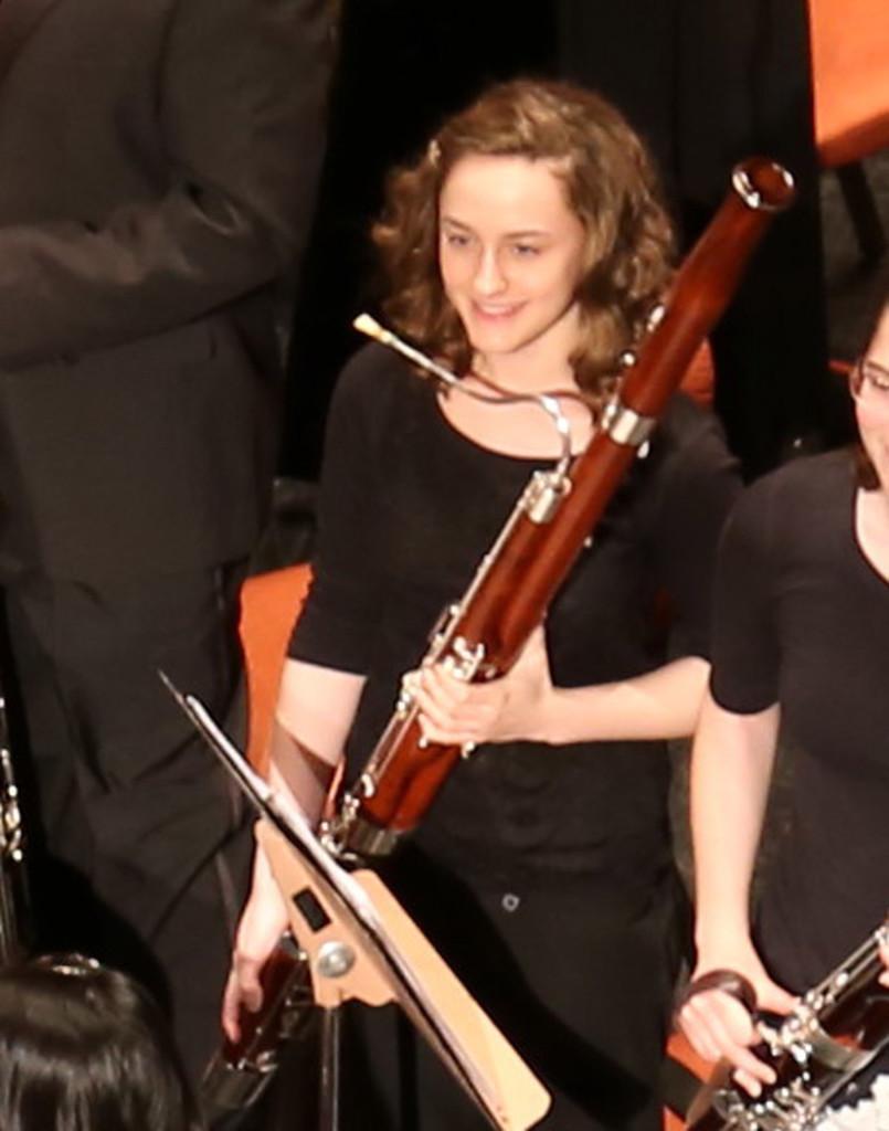 Junior Brigit Fitzgerald smiles with her bassoon at the Arizona All-State Music Festival.