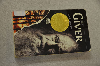 "The Giver" by Lois Lowry. Not all the books you pick up over summer have to be beach reads.