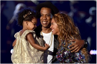 Beyoncé with husband Jay-Z and daughter Blue Ivy. The family came into a group hug after she  accepted her MJ Video Vanguard Award. 
