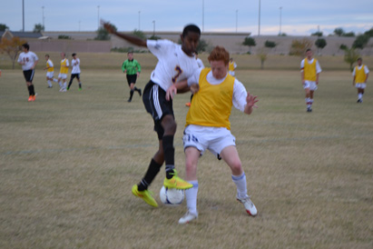 Senior Shawn Dixon scrambles to take a ball from Maricopa.