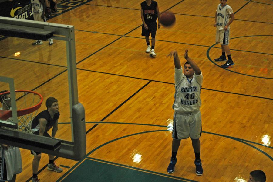 Jared Gates hits a Free throw  during a game versus American Leadership Academy.