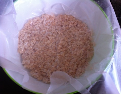 7. Put a piece of parchment paper on the top of the mixture in your bowl and press lightly to make sure it’s flat.
