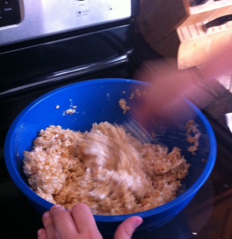 3. Add 6 cups of Rice Krispies to the melted marshmallows.