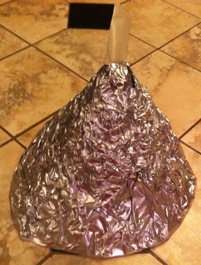 Wrap your treat in tin foil, covering the parchment paper message, but letting the part that hangs off the top be free.