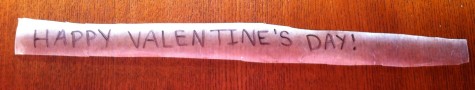 9. While your treats are setting, write a message on a strip of wax paper. I used the phrase “Happy Valentine’s Day,” but you can personalize it to be more sentimental. 