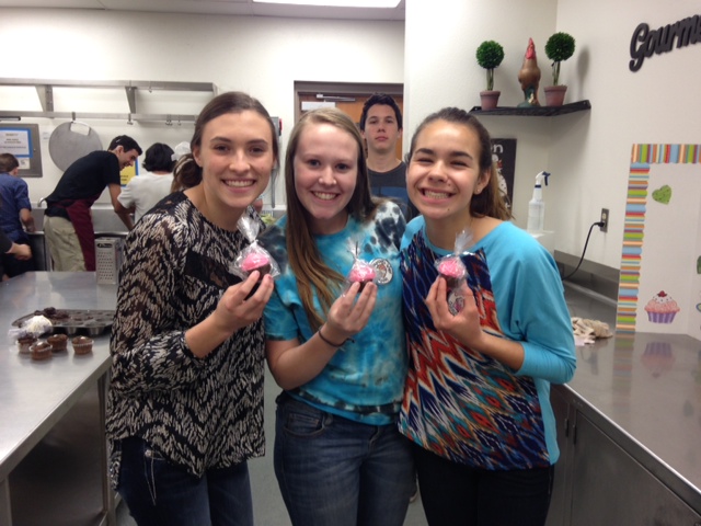 And the winner was...group one! Eagerly, the girls hurried to claim their prize. Each of the champions won a custom Cupcake Wars Champion pin, and chocolate cupcake. Although there was one winner, all teams did a fabulous job showing their creative cupcake talents!