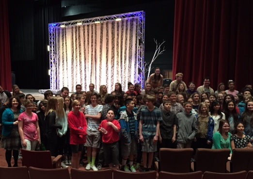 Every seventh grader who went on the field trip, Mrs. Wood (seventh grade Humanities teacher), and several of the actors who performed in Macbeth gathered for a picture after the performance.