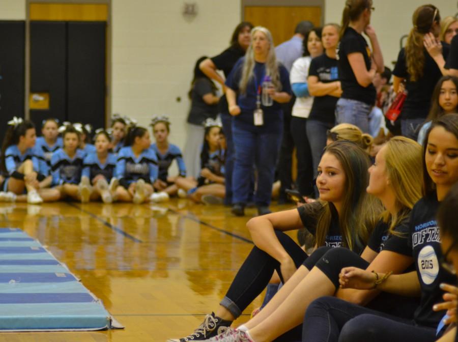 Members of the softball team await their turn to be announced at the Pep Rally.  Members of various functions of the school sat together in anticipation of their group being called.