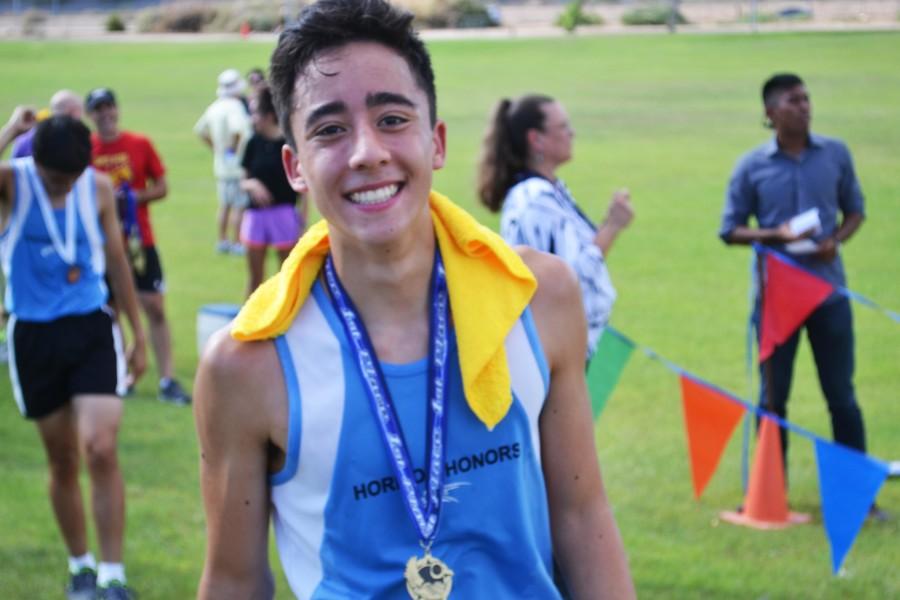 Trevor Tam smiles after finishing first at the Pecos Invitational.