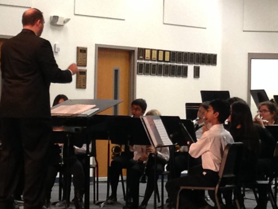 Eric Best, band director, conducts the Wind Ensemble.
