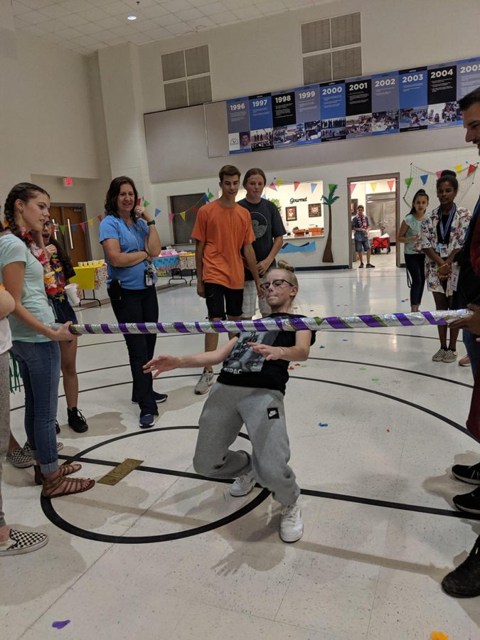 Seventh grader Natalie Ratliff shows off her skills at limbo, winning the competition.