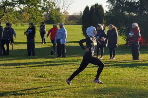 Noor Alexandria Abukaram running the 5k cross-country race.