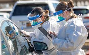 Two healthcare workers registering patients in New York.