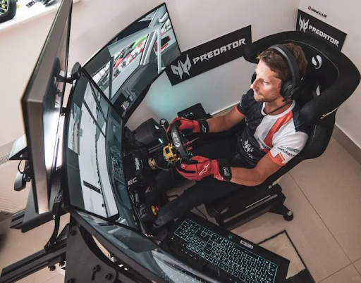 Indycar driver Romain Grosjean using his at-home simulator.