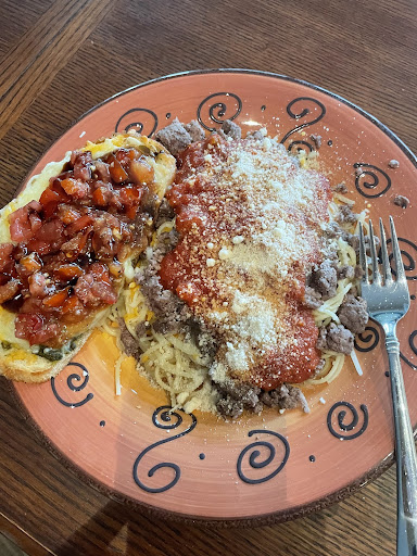 Delicious bruschetta paired with homemade spaghetti.