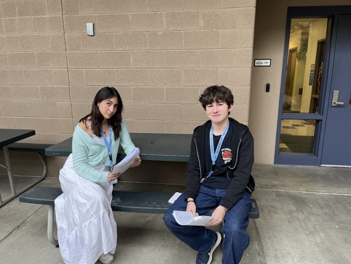 Domenica Alberca Escobar (left) and Colton Johnston (right) wait to audition for "Beauty and the Beast."