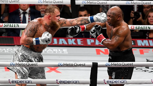 Jake Paul and Mike Tyson battle it out in the ring.