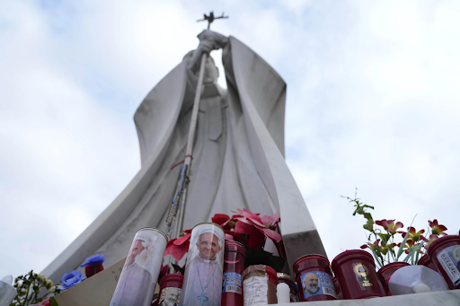 Candles and flowers left by the citizens of Rome for Pope Francis