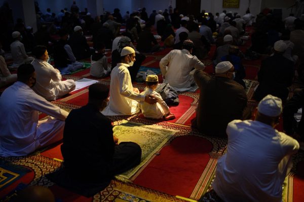 Muslims gather for Eid al-Fitr prayer in Bradford Central Mosque in England. 