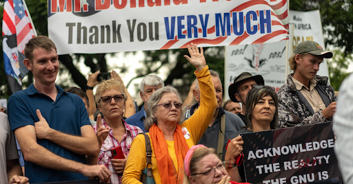 A group of white South Africans gather outside of the U.S. embassy in Pretoria.