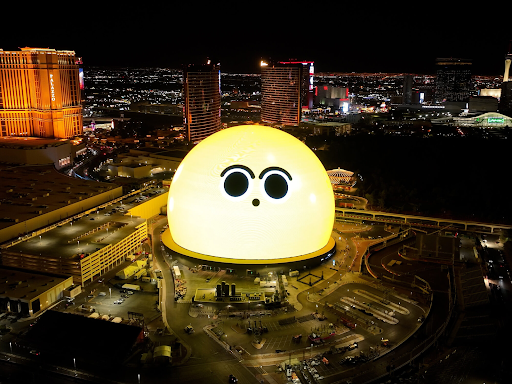 Picture of a bright yellow face on the Las Vegas Sphere.