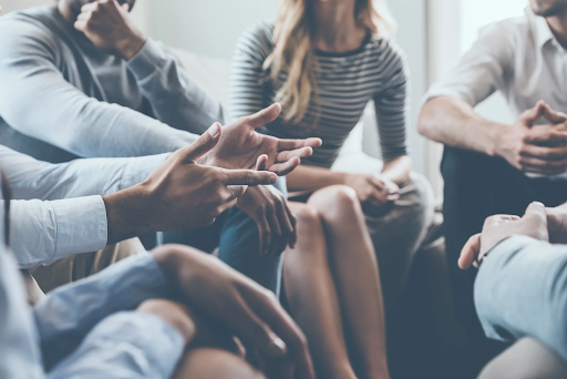 Image of a group of adults talking.