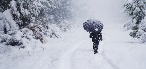 Image of someone walking in a snowstorm